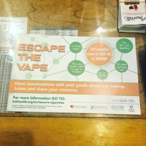 An Escape the Vape campaign poster displayed inside Down the Hall Home Brew in downtown Belleville. 